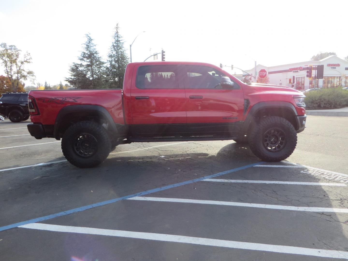 2023 Red /BLACK RAM 1500 Ram 1500 TRX Crew Cab 4x4 (1C6SRFU9XPN) with an 6.2L Supercharged HEMI V8 SRT engine, 8 Speed Auto 8HP95 transmission, located at 2630 Grass Valley Highway, Auburn, CA, 95603, (530) 508-5100, 38.937893, -121.095482 - Must see TRX featuring Eibach front and rear springs, 18" Method NV double black wheels, 37" Nitto Ridge Grappler tires, and window tint. - Photo#4